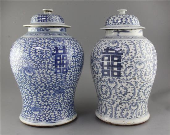 Two large Chinese blue and white vases and covers, 19th century, height 42cm and 43cm